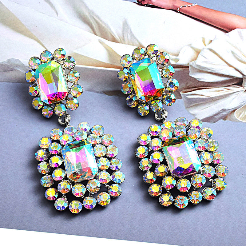 Fashion earrings with large diamonds set in round geometric water droplets