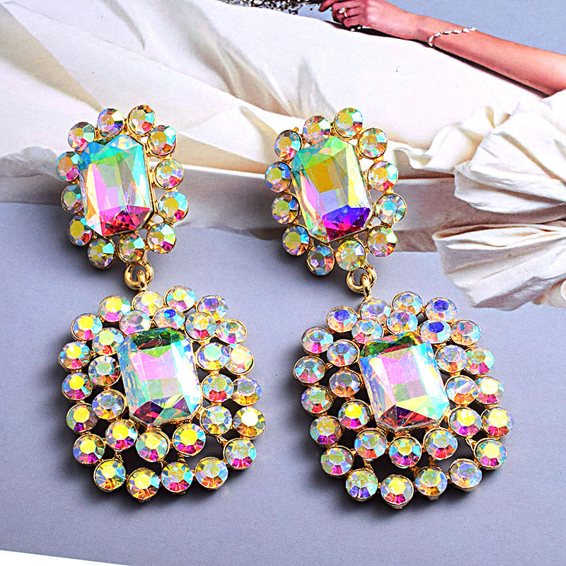 Fashion earrings with large diamonds set in round geometric water droplets
