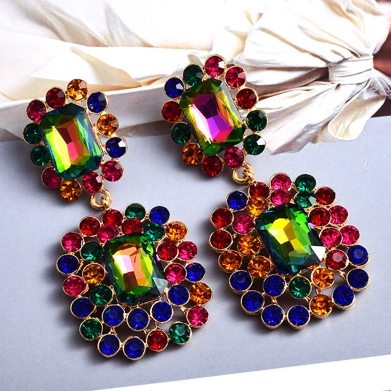 Fashion earrings with large diamonds set in round geometric water droplets
